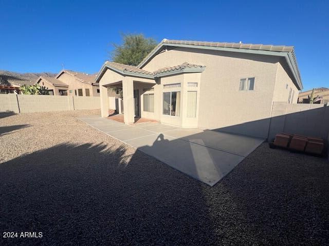 rear view of house featuring a patio