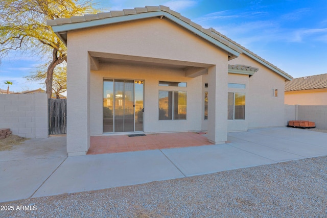 rear view of house featuring a patio area