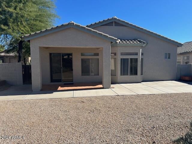 back of house featuring a patio area