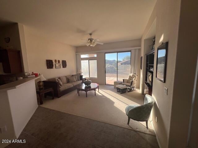 living room with carpet flooring and ceiling fan