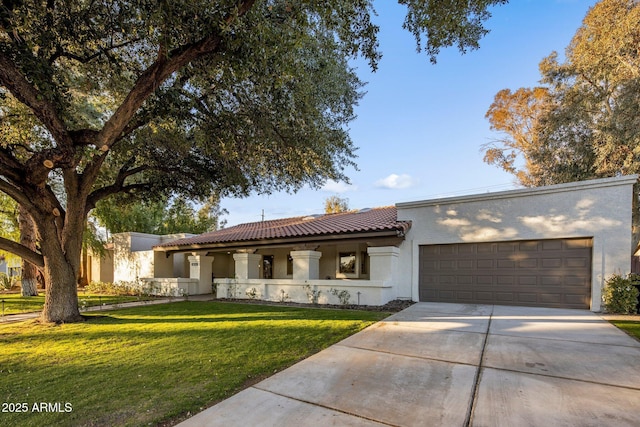 view of front facade with a front yard and a garage