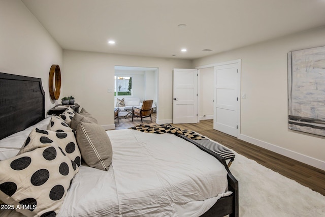 bedroom with hardwood / wood-style flooring