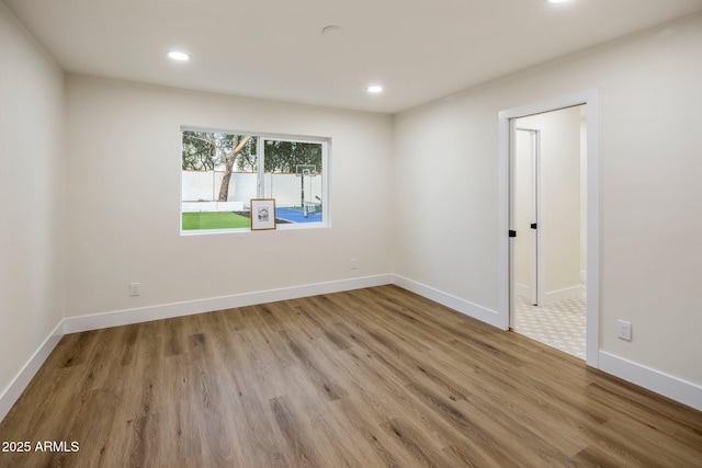 spare room featuring light hardwood / wood-style flooring