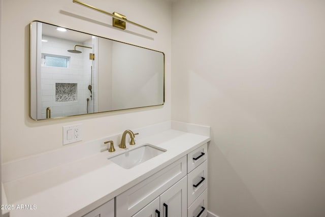 bathroom featuring vanity and a tile shower