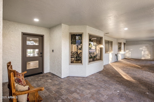 entrance to property with a patio area