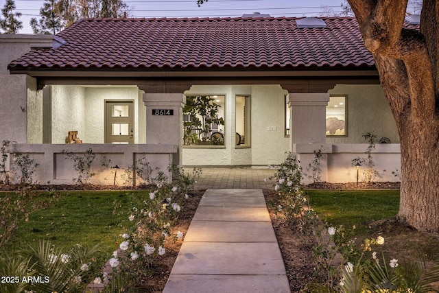 mediterranean / spanish-style house featuring a front lawn