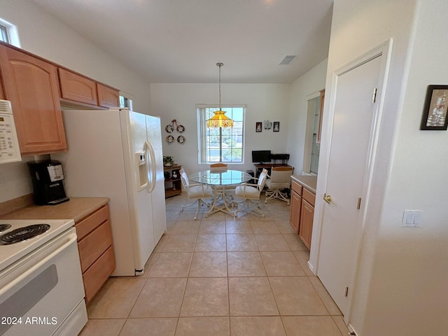 kitchen with light brown cabinetry, decorative light fixtures, white appliances, and light tile patterned floors