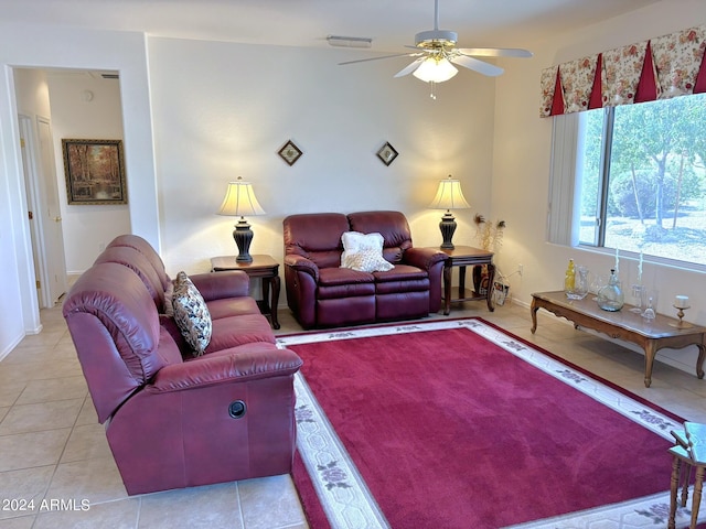 living room with light tile patterned floors and ceiling fan