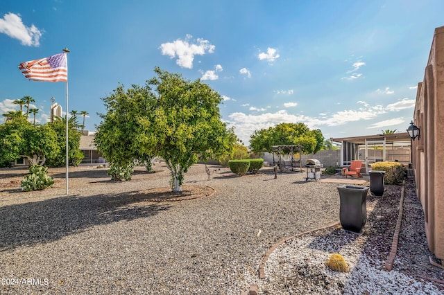 view of yard featuring fence and a patio