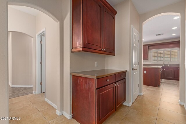 kitchen featuring light tile patterned flooring