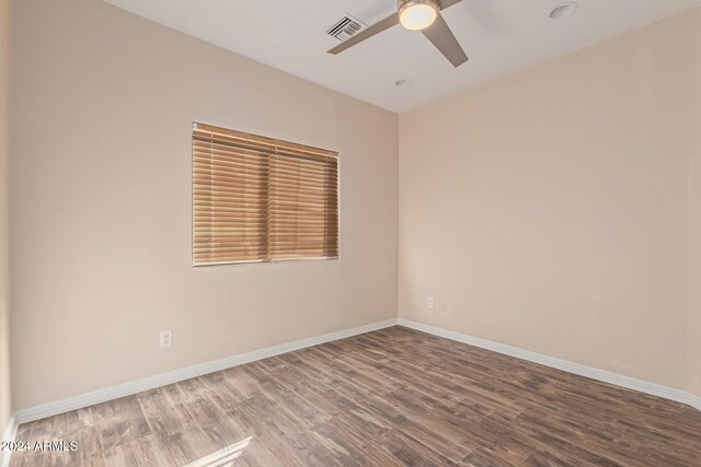 spare room featuring ceiling fan and wood-type flooring