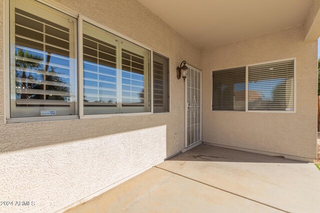 doorway to property with a patio