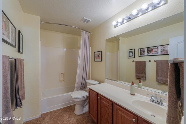 bathroom featuring visible vents, toilet, shower / bath combo, vanity, and a textured ceiling