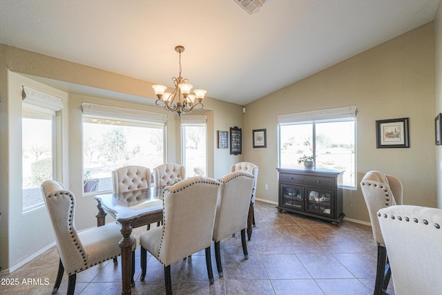 dining area featuring a wealth of natural light, lofted ceiling, visible vents, and an inviting chandelier