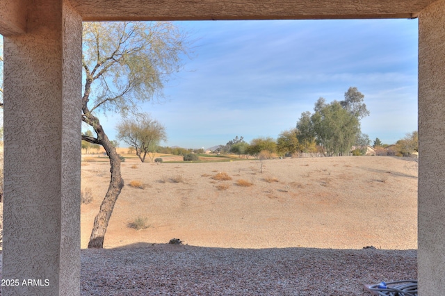 view of yard with a rural view
