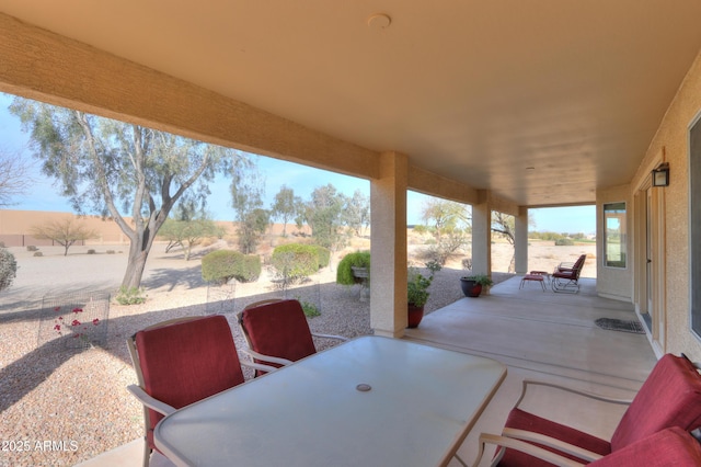 view of patio featuring outdoor dining space and a fenced backyard
