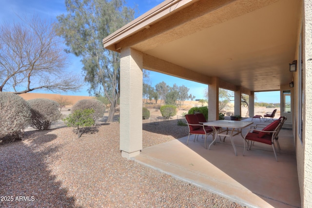 view of patio with outdoor dining area