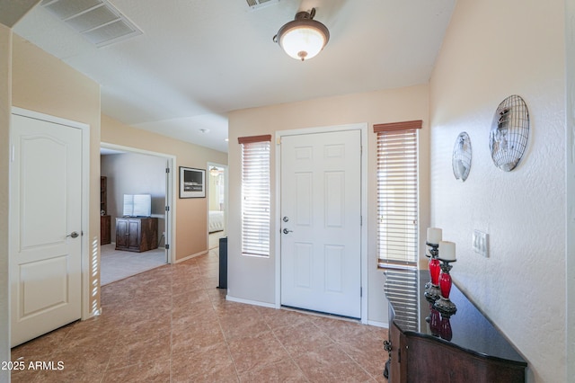 entrance foyer featuring visible vents and baseboards