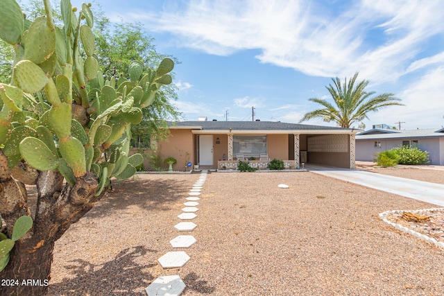 view of front of home featuring a carport