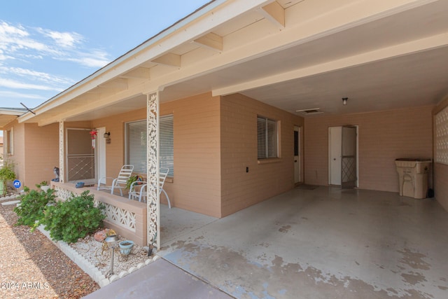 exterior space with a carport