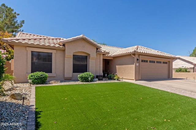 6357 W Potter Dr, Glendale, AZ 85308 - mediterranean / spanish house featuring a tiled roof, stucco siding, an attached garage, a front lawn, and concrete driveway