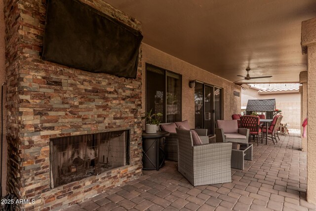 6357 W Potter Dr, Glendale, AZ 85308 - view of patio featuring exterior fireplace, a ceiling fan, and outdoor dining area