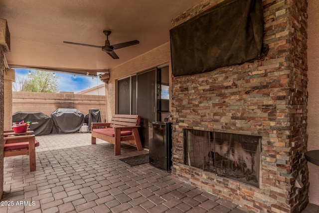 6357 W Potter Dr, Glendale, AZ 85308 - view of patio / terrace featuring an outdoor brick fireplace, ceiling fan, and a grill
