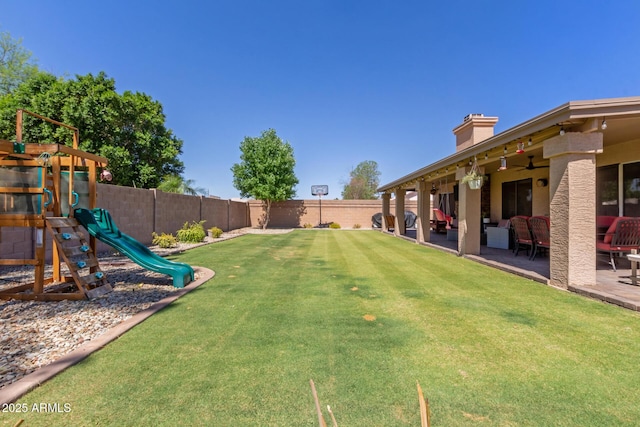 6357 W Potter Dr, Glendale, AZ 85308 - view of yard featuring a playground, ceiling fan, and a patio area