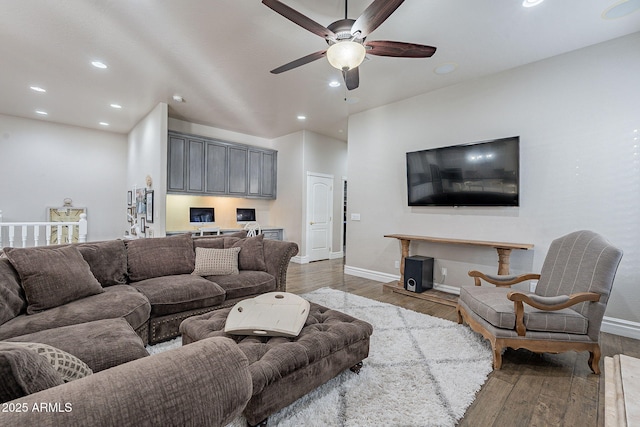 living room with hardwood / wood-style floors, ceiling fan, and built in desk