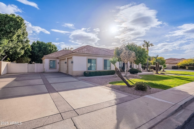 mediterranean / spanish-style home with a front yard