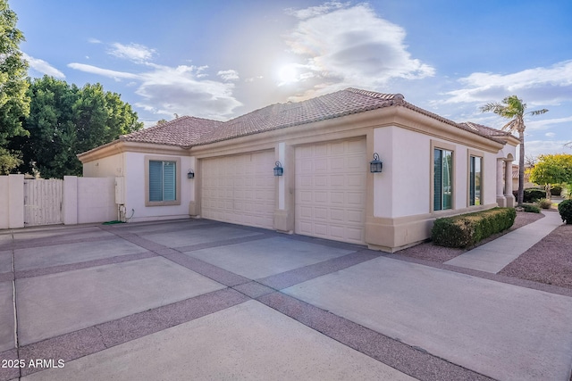 view of side of property with a garage