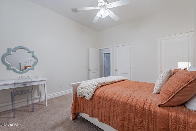 carpeted bedroom featuring ceiling fan and vaulted ceiling