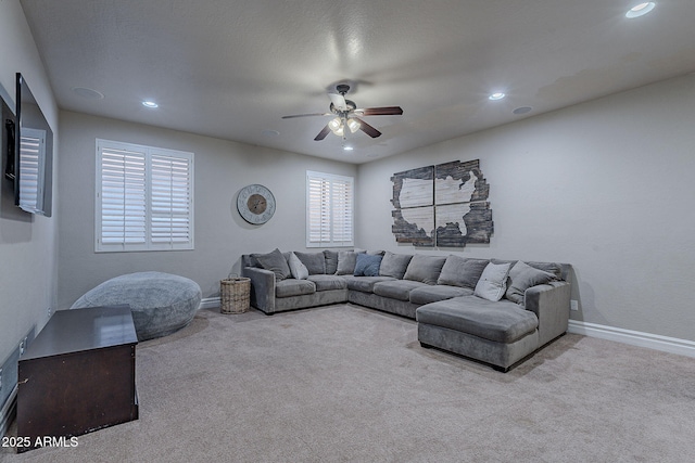 living room featuring ceiling fan and light colored carpet