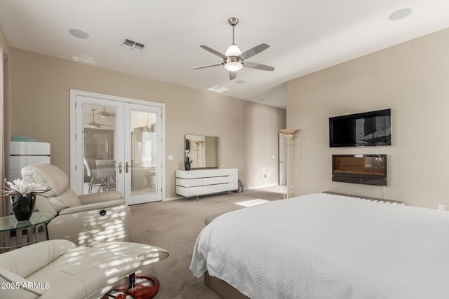 carpeted bedroom with baseboards, visible vents, ceiling fan, access to exterior, and french doors