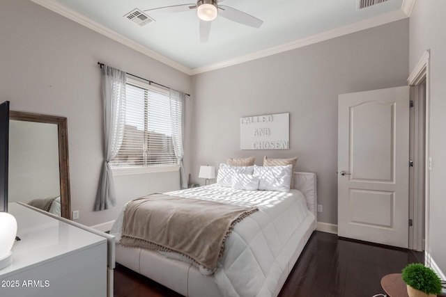 bedroom with visible vents, dark wood-style flooring, and ornamental molding