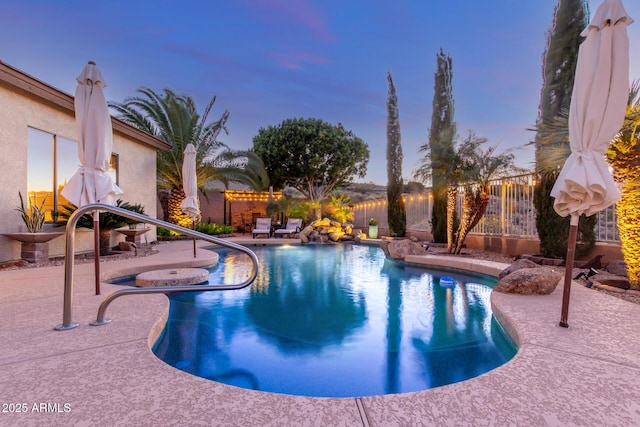 view of swimming pool with a fenced in pool, a patio, and a fenced backyard