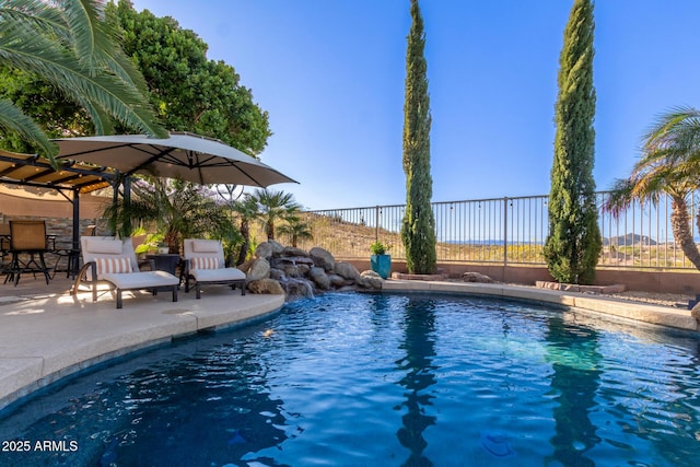 view of pool featuring a fenced in pool, a patio, and fence