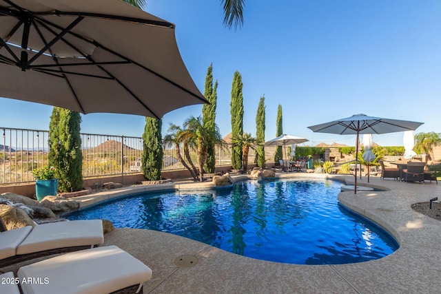 view of pool with a patio area, a fenced in pool, and a fenced backyard