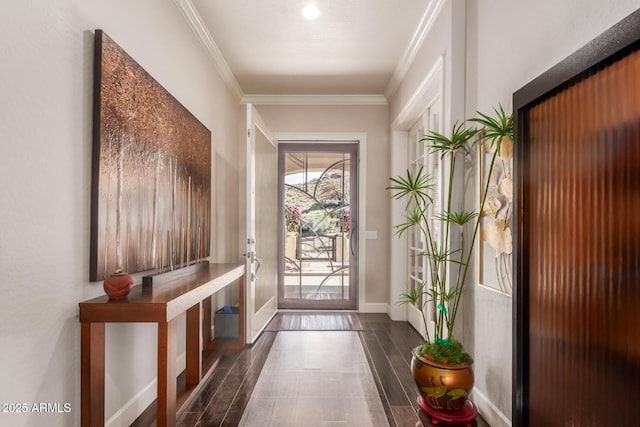 doorway to outside featuring french doors, wood finished floors, baseboards, and ornamental molding