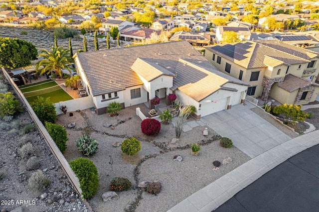 birds eye view of property with a residential view