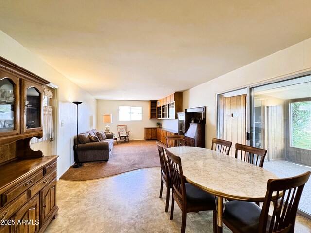 dining area with light carpet