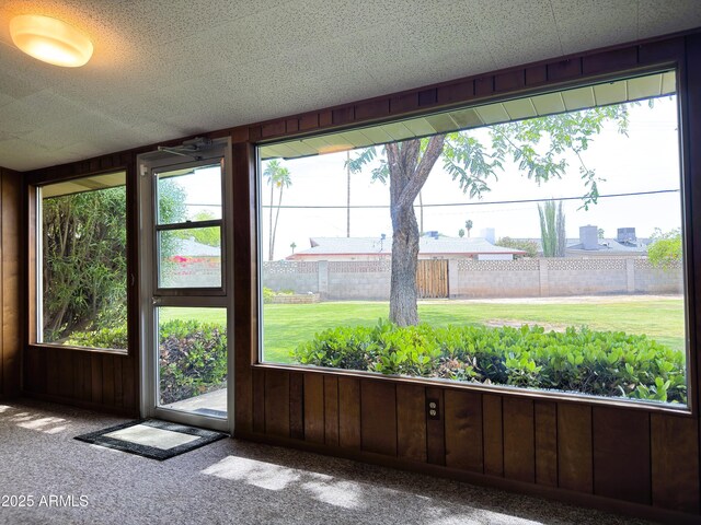 unfurnished sunroom featuring a wealth of natural light
