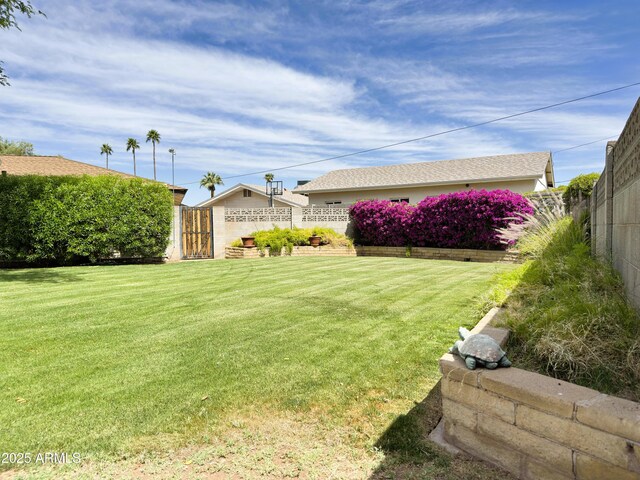 view of yard featuring fence