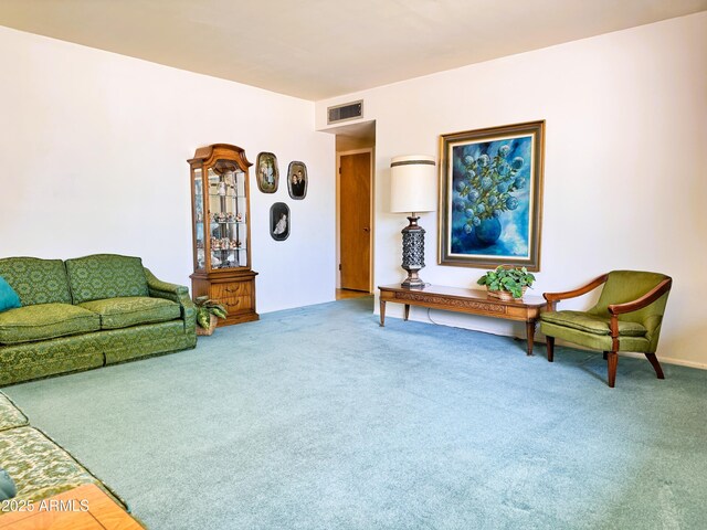 living room with visible vents and carpet flooring