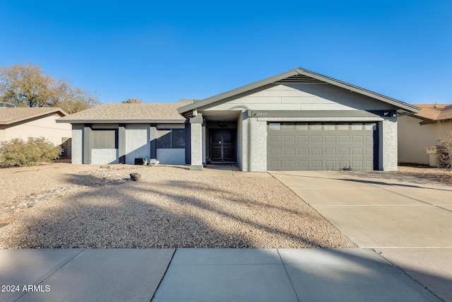 ranch-style home with a garage