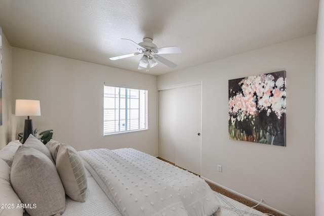 bedroom with carpet floors, a closet, and ceiling fan