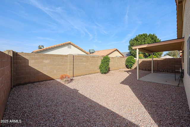 view of yard with a fenced backyard and a patio