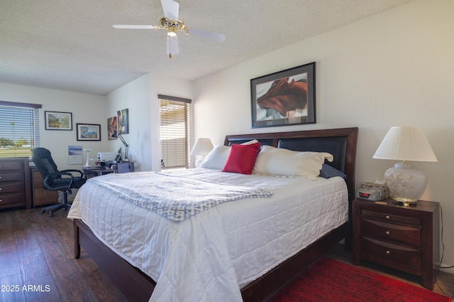 bedroom with a textured ceiling, a ceiling fan, and hardwood / wood-style floors