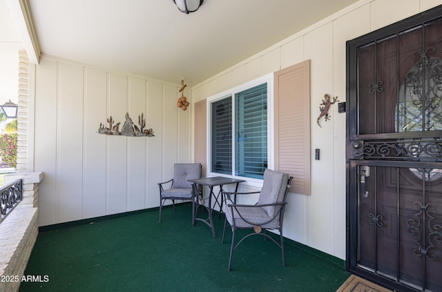 view of exterior entry with covered porch