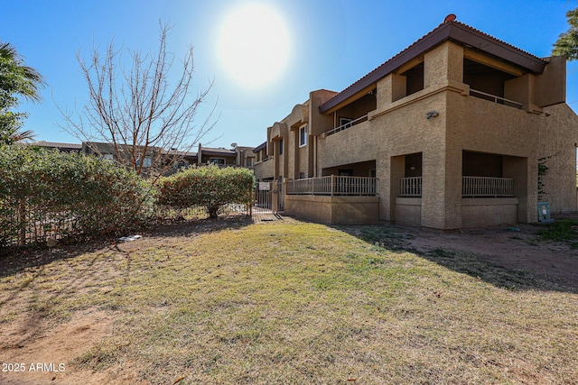 view of yard featuring a balcony